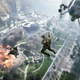 An image from Battlefield 2042 depicting some soldiers jumping out of a helicopter onto an explosion-riddled warzone.